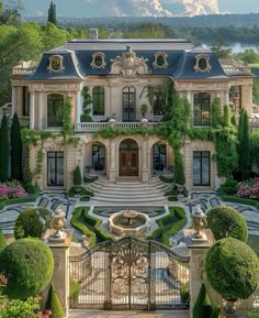 this is an image of a beautiful mansion in the middle of trees and bushes around it