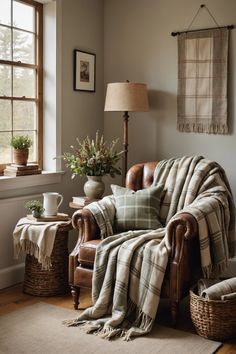 a living room with a plaid blanket on the couch and two wicker baskets next to it