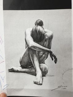 a drawing of a woman sitting on the ground with her head down and hands behind her back