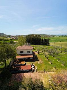 an aerial view of a house in the countryside