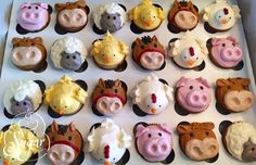 cupcakes in the shape of farm animals and pigs