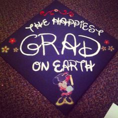 graduation cap that says the happlesy grad on earth