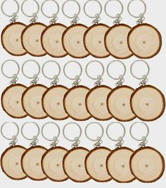 a set of six wooden slices with metal rings hanging from each one's side