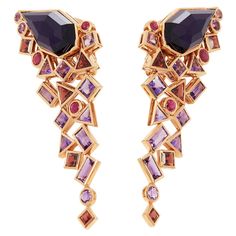 These Earrings by Stephen Webster are from his Crystal Haze Gold Struck Collection and features Two Synthetic Amethyst set sections Totalling 14.50cts Surrounded by mixed cut Amethyst and Red Garnets. Set in 18k Rose Gold. Stephen Webster Jewelry, Amethyst Set, Stephen Webster, Rose Gold Crystal, Sparkly Jewelry, Elsa Peretti, Couture Jewelry, Gold Crystal, Amethyst Earrings