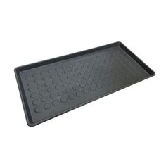 a black tray with circles on it