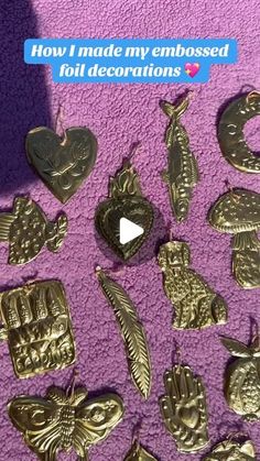 some gold colored metal items on a purple blanket with the words how i made my embossed foil decorations