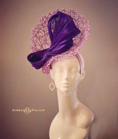 Structured, chic criss-cross woven material on this asymmetrical showpiece. Luscious purple silk ribbon feature.   Easy-to-wear headband fascinator makes a statement, and can be worn to a myriad of events: Easter, Bridal, Derby-Wear, Del Mar Races, Hat Contests, Church, Gala, Kentucky Derby, Melbourne Cup, High Tea, Weddings, Cocktail Parties, Weddings, and More.  Some customization available as this is made-to-order; please message with your requests to see if we can meet your needs. Other colors available; please inquire before purchase if you need another color. Please note: this one particular piece is made-to-order, and has an extended handling time.  *FREE SHIPPING  For more STATEMENT JEWELRY and HANDMADE HATS go to www.aimeesfuller.com Aimee Fuller has been a trusted online seller s Chic High Crown Fascinator, Chic Fitted High Crown Fascinator, Fitted Hat With Curved Brim For Fashion Events, Fitted Mini Hats For Fashion Events, Fitted Fascinator For Kentucky Derby Fashion Events, Elegant Purple Top Hat For Royal Ascot, Elegant Purple Top Hat For Races, Elegant Purple Top Hat With Curved Brim, Fitted Mini Hat With Structured Crown In Sinamay