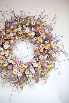 a floral wreath hanging on the wall