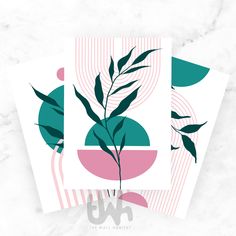 two cards with green leaves on them, one is pink and the other is teal