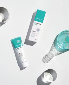 three different types of skin care products on a white surface with shadows coming from them