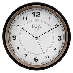 an analog clock with roman numerals on the face and numbers in black, gold and white