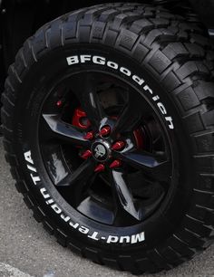 the wheel and tire of a black truck