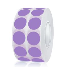 a roll of white and purple polka dot tape on a white background with reflection in the middle