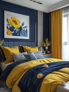 a bedroom with yellow and blue bedding in front of a painting on the wall