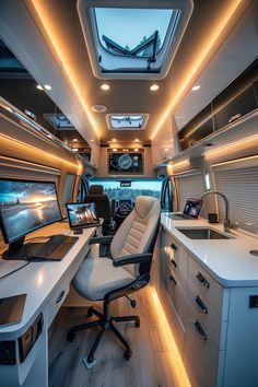 the interior of a vehicle with a desk and laptop