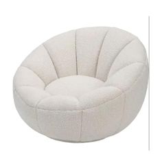 a white round chair sitting on top of a floor