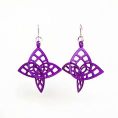 This is a pair of very lightweight 3D printed earrings in laser sintered nylon plastic. The design is  derived from an Enneper surface.  In mathematics, an Enneper surface is a self-intersecting surface introduced by Alfred Enneper 1864 in connection with minimal surface theory. Other than the self-intersecting aspect, I don't understand much of the other details about this surface, but I love the way it looks.  From the front, these earrings resemble flowers.  Because these earrings are so lightweight, they move easily as the wearer moves.  The earrings can look quite different, depending upon the viewing angle.  From the side, they take on a more geometric look. Earring hooks:  Sterling silver Jump rings:  Silver plated brass---- NOTE:  I often have other colors of these earrings in stoc 3d Printed Earrings, Mod Earrings, Printed Earrings, Mod Jewelry, Minimal Surface, I Don't Understand, 3d Printed Jewelry, Light Weight Jewelry, Costume Earrings