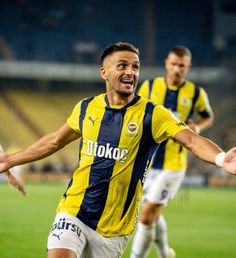 a soccer player is celebrating his team's win over the other team in a game