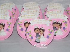 pink paper plates decorated with wedding pictures and name tags for the bride and grooms