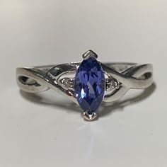 a ring with a blue stone in the center