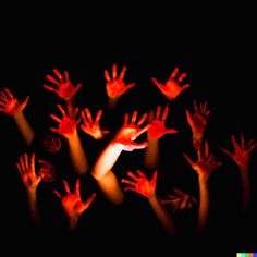 many hands are shown in the dark with their fingers extended up to show off red light