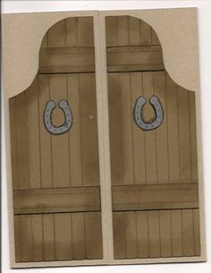 two wooden doors with horseshoes on them