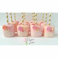 pink and gold candles with roses on them