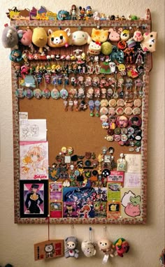 a bulletin board covered in lots of different types of pins and magnets on it