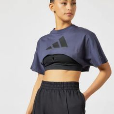 A Cropped-Tee For Post-Yoga Comfort. All Those Planks And Warrior Poses Are Paying Off. Show Off Your Hard-Earned Yoga Abs In This Adidas Crop Top. Pair It With A Favorite Pair Of High-Rise Tights, And Move Through The Day In Total Comfort. Our Cotton Products Support More Sustainable Cotton Farming. Loose Fit Ribbed Crewneck 100% Cotton Single Jersey Sleeve Pocket Cropped Length Single Jersey Supports The Better Cotton Initiative Color: Shadow Navy Do Not Bleach Do Not Tumble Dry Do Not Dry Cle Blue T-shirt For Gym, Blue Crew Neck Crop Top For Sports, Adidas Cotton Sportswear Tops, Sporty Cotton Yoga Top, Blue Crew Neck T-shirt For Yoga, Adidas Moisture-wicking Tops For Workout, Adidas Moisture-wicking Workout Tops, Adidas Athleisure Short Sleeve Activewear, Cotton Sportswear Tops For Yoga