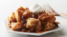 a close up of a plate of food with syrup and ice cream on the top