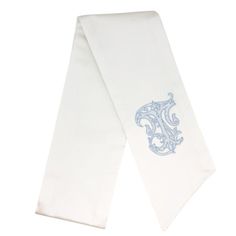 As part of our bridal collection, this snow white sash is perfect for your bouquet, wreaths on the church door or a pew marker. Also available in a longer and wider version. Please allow 3-5 days for personalization. For use indoors and dry, covered outdoor spaces. Details To Note Wreath sash measures 52" x 4.5" Monogram is approximately 3.5" tall Spot clean only For all other custom monogram options, email info@figanddove.com.