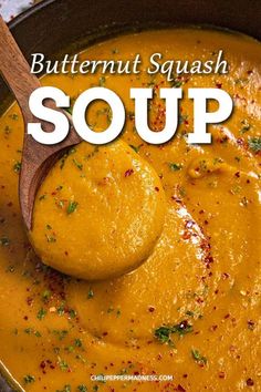 butternut squash soup in a black bowl with a wooden spoon and title overlay reads butternut squash soup