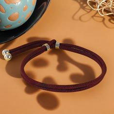 This Halloween-themed adjustable cord bracelet is the perfect seasonal accessory. Crafted with a durable braided cord, it comes in three eye-catching colors: green, blue, and dark purple. Its adjustable design allows for a comfortable fit on any wrist size, while the metal accents add a touch of elegance to its spooky charm. The bracelet is featured in a playful Halloween setting, paired with jack-o'-lanterns, making it an ideal complement to your festive attire. Whether you're looking to access Adjustable Cord Bracelet, Festive Attire, Stylish Bracelet, Cord Bracelet, Fete Halloween, Cord Bracelets, Colorful Bracelets, Eye Catching Colors, Metallic Accents