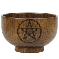 a wooden bowl with an inverted pentagram on the side and a star in the middle