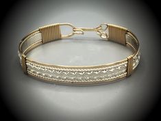 This classic wire sculpted bracelet was created using sterling silver with 14kt gold-filled. It's a 3/8 inch thick. This bangle looks great alone or stacked with other bracelets. It's also available in rose gold-filled and Sterling. The wire bracelet will be custom made with the measurement you provide. Please provide me with the circumference of your wrist. How to measure: You will need a flexible measuring tape. If you don't have a flexible measuring tape, you can use a strip of paper or strin Mixed Metal Bracelets, Bangles Design, Wire Jewelry Designs, Bangles Jewelry Designs, Bangle Designs, Jewelry Lookbook, How To Measure, Unisex Accessories, Wire Bracelet