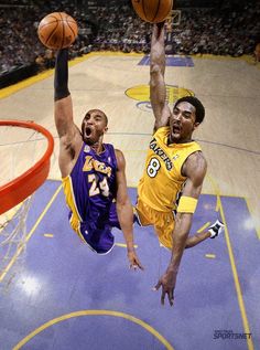 two basketball players in the air during a game