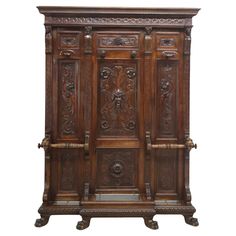 an old wooden cabinet with carvings on the doors