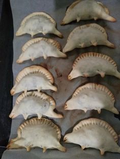 some kind of food that is sitting on a pan and ready to be cooked in the oven