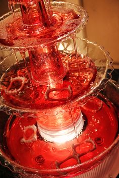 the red liquid is being poured into the blender to make it look like something out of space