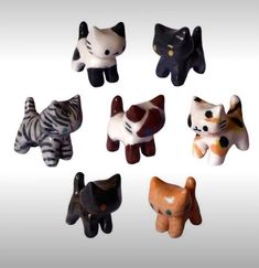 small ceramic animal figurines in various shapes and sizes