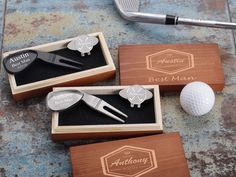 three different types of golf putter's club in their wooden boxes with the same logo on them