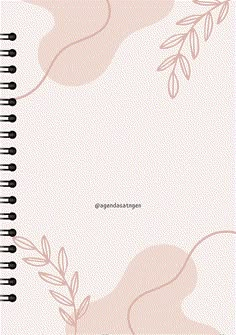 a spiral notebook with pink leaves on it