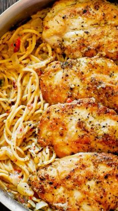 chicken and pasta in a skillet on a wooden table