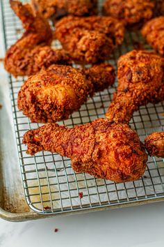 fried chicken on a cooling rack ready to be cooked