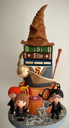 a cake made to look like harry potter's hat and other things on top