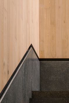 an image of stairs going up the side of a building with wood walls in the background