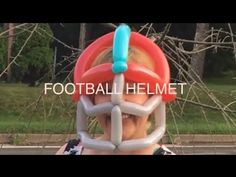 a man with a ball in his head and the words football helmet on it's face