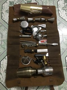 an assortment of kitchen utensils laid out on a table