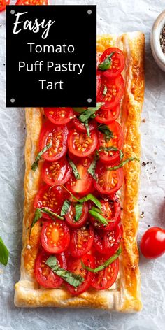 an easy tomato puff pastry tart with fresh basil on top and the words easy tomato puff pastry tart above it