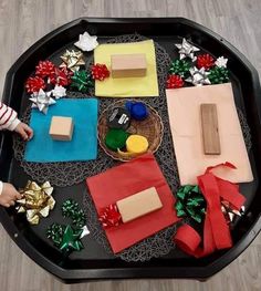 a tray with different types of soaps and decorations on it, including christmas trees